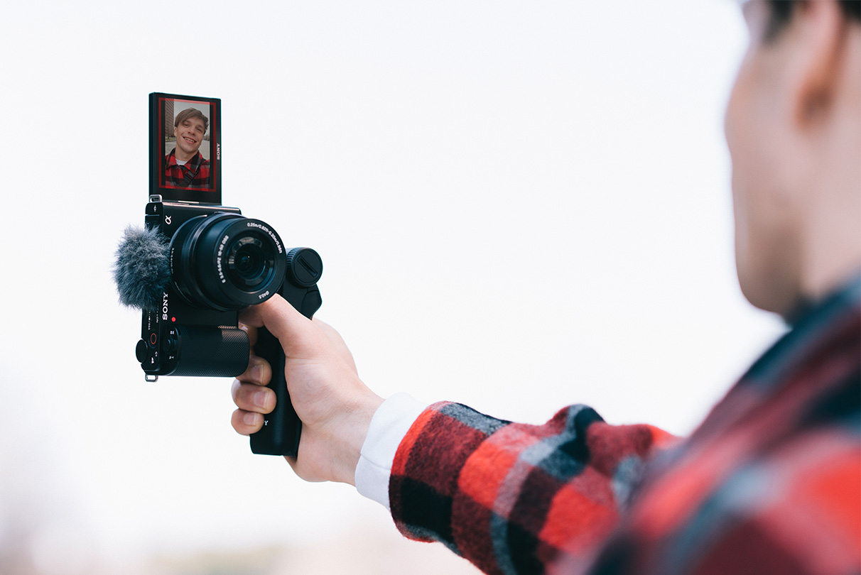 Situational image of a person shooting video vertically