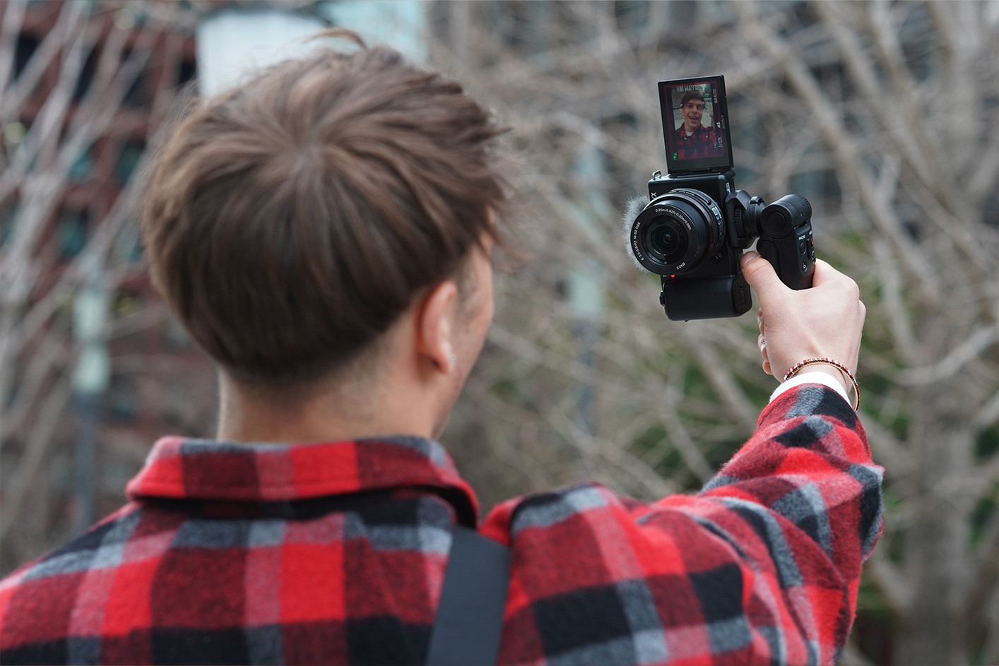 Image of a person shooting video vertically