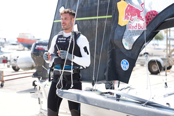 Example image showing a man standing near the sailing yacht