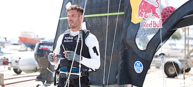 Example image showing a man standing near the sailing yacht