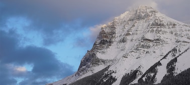 A photo of a mountain with snow on the top