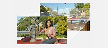 Photo of a woman waving to the camera.