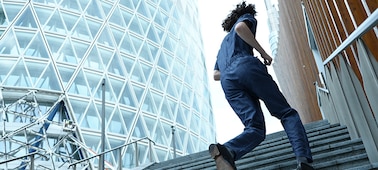 Example image of a man running up the stairs